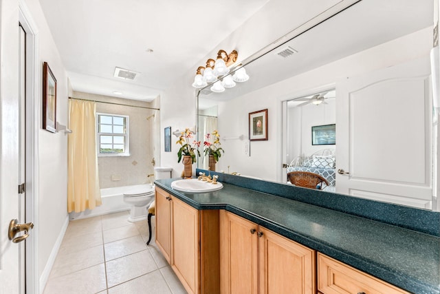 full bathroom with ceiling fan, tile patterned flooring, shower / bath combination with curtain, toilet, and vanity