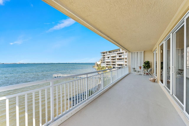 balcony featuring a water view