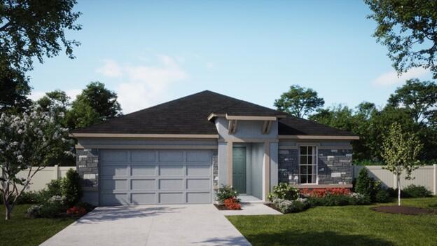 view of front of property with a front yard and a garage