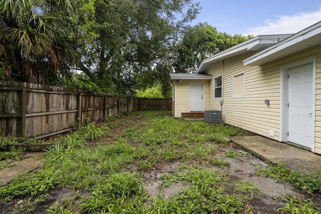 view of yard with central AC unit