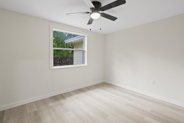 unfurnished room featuring ceiling fan and light wood-type flooring