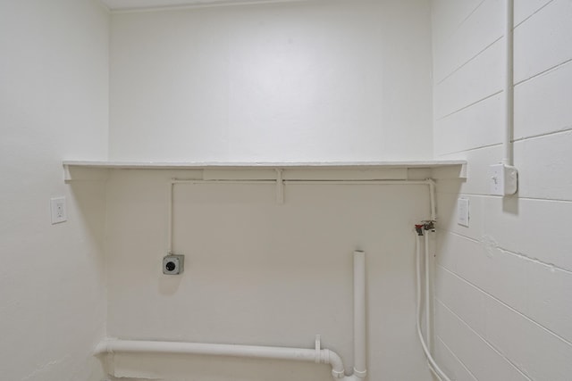 washroom with hookup for an electric dryer and hookup for a washing machine