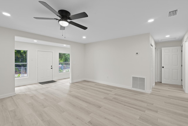 unfurnished room featuring light hardwood / wood-style floors and ceiling fan