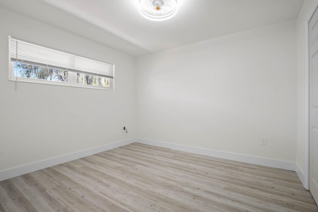 spare room with light hardwood / wood-style flooring