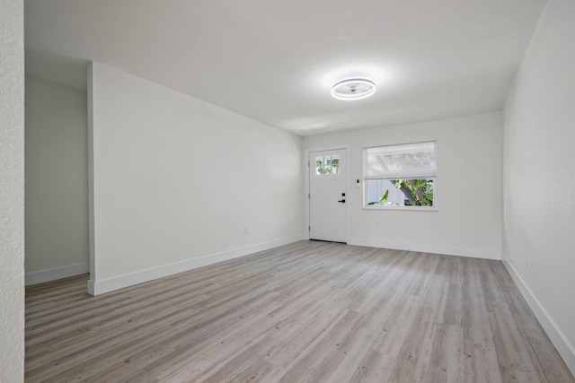 spare room featuring light hardwood / wood-style floors