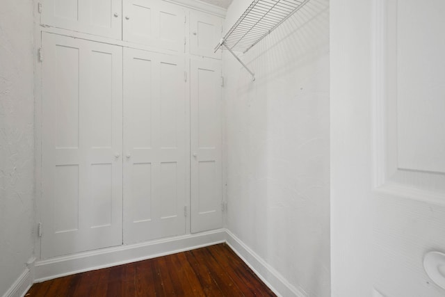 walk in closet featuring dark hardwood / wood-style flooring