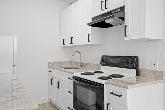 kitchen with sink, light stone counters, light hardwood / wood-style floors, white appliances, and white cabinets