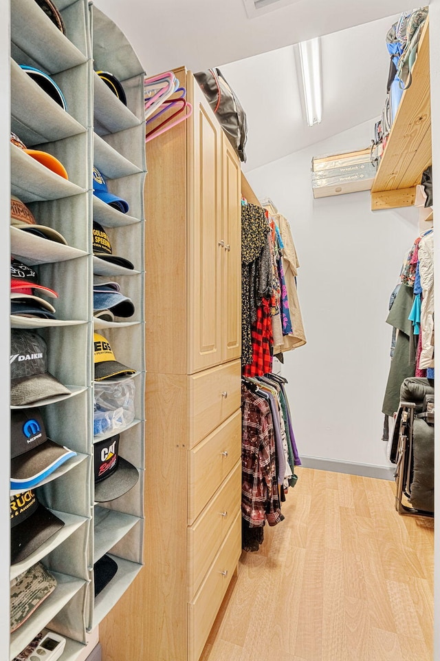 spacious closet featuring hardwood / wood-style flooring