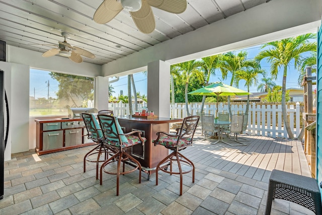 exterior space with ceiling fan