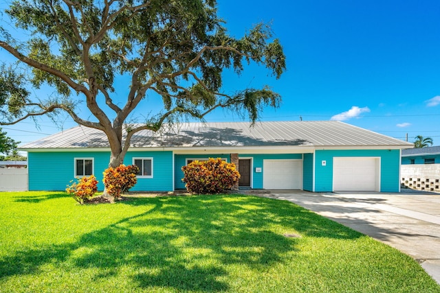 ranch-style home with a front yard and a garage