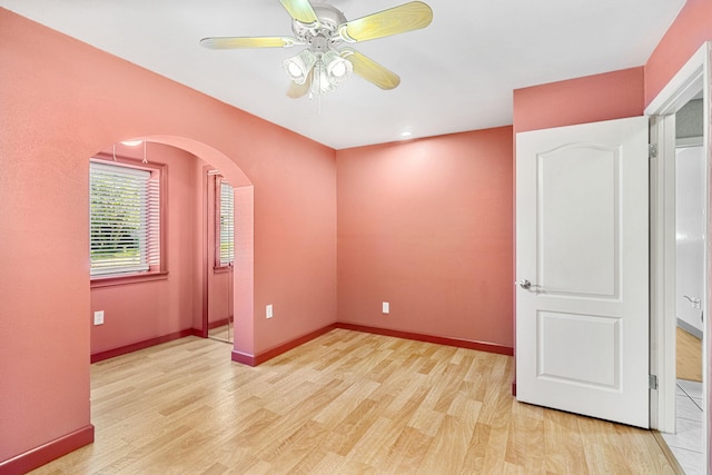 unfurnished room featuring ceiling fan and light tile floors