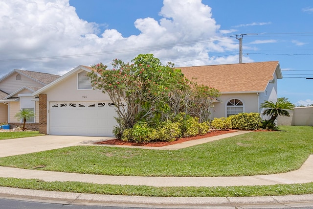 view of front of house featuring a front yard and a garage