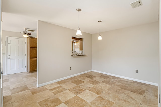 spare room with ceiling fan