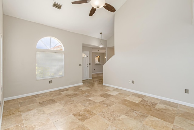 interior space featuring ceiling fan and high vaulted ceiling