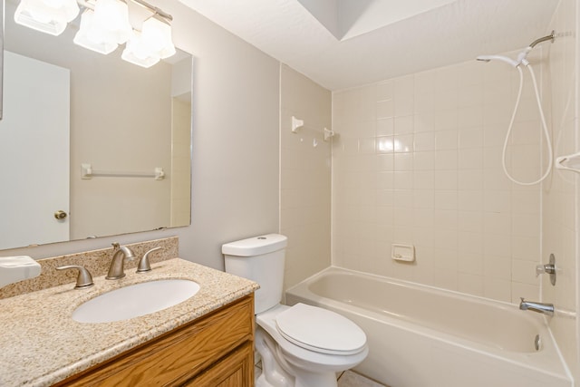 full bathroom featuring vanity, toilet, and tiled shower / bath combo