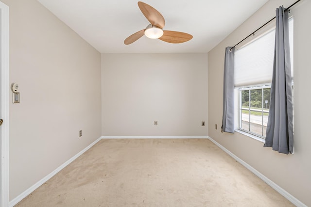 carpeted empty room with ceiling fan