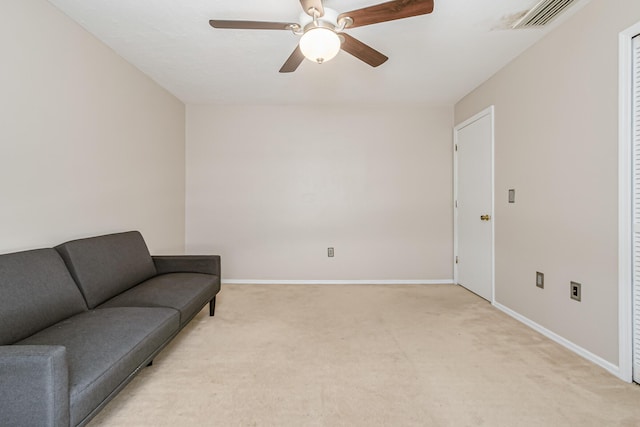 sitting room featuring ceiling fan and light carpet