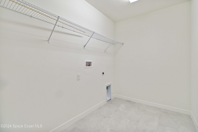 clothes washing area featuring washer hookup and hookup for an electric dryer