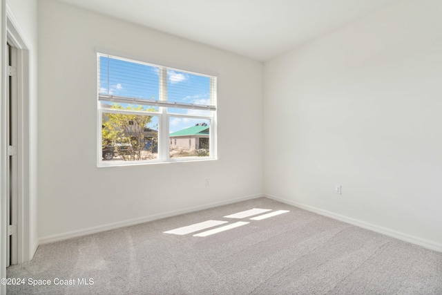 unfurnished room with carpet