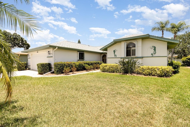 view of front of home featuring a garage and a front lawn