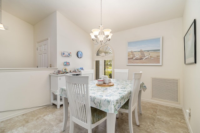 dining space featuring a notable chandelier