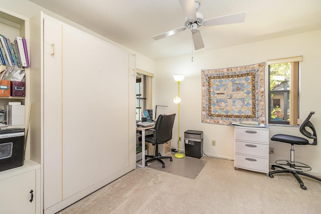 office area with light colored carpet and ceiling fan