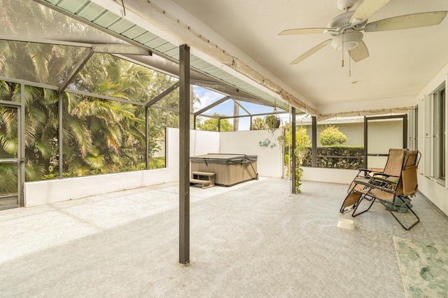 sunroom / solarium featuring ceiling fan