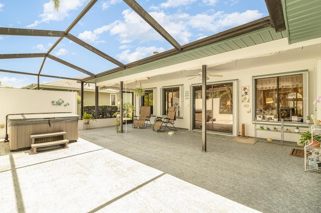 view of patio / terrace with a hot tub, a lanai, and ceiling fan