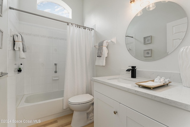 full bathroom with vanity, toilet, shower / bath combo, and hardwood / wood-style floors