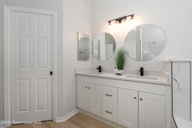 bathroom featuring vanity and hardwood / wood-style floors