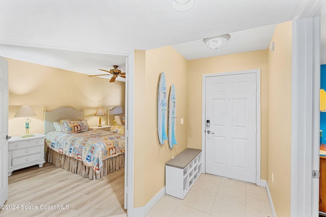 bedroom with ceiling fan and light wood-type flooring