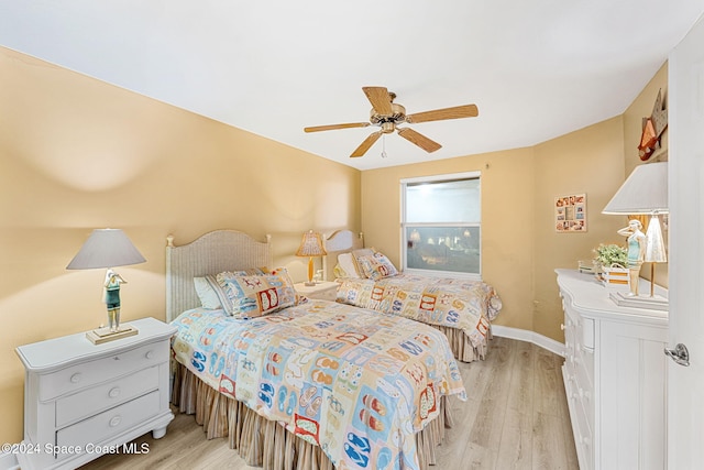 bedroom featuring light hardwood / wood-style flooring and ceiling fan