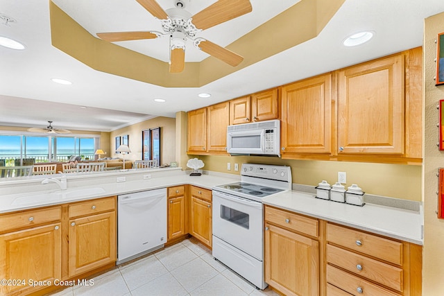 kitchen with light tile patterned floors, white appliances, ceiling fan, and sink