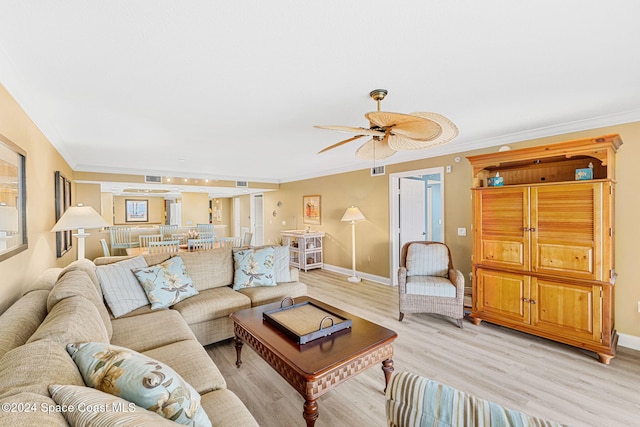 living room with ceiling fan, light hardwood / wood-style flooring, and ornamental molding