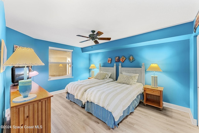 bedroom featuring ceiling fan and light hardwood / wood-style flooring