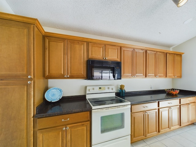 6256 Mirror Lake Ct Unit 6256, Sebastian, FL 32958 - kitchen with electric stove, light tile patterned floors, and a textured ceiling