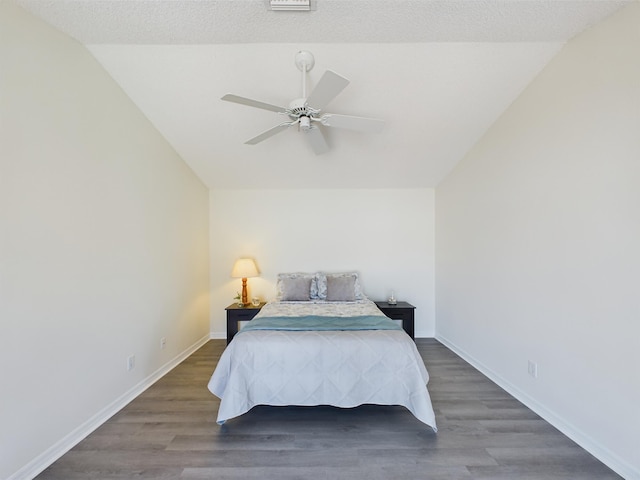6256 Mirror Lake Ct Unit 6256, Sebastian, FL 32958 - bedroom with dark wood-type flooring, ceiling fan, and vaulted ceiling