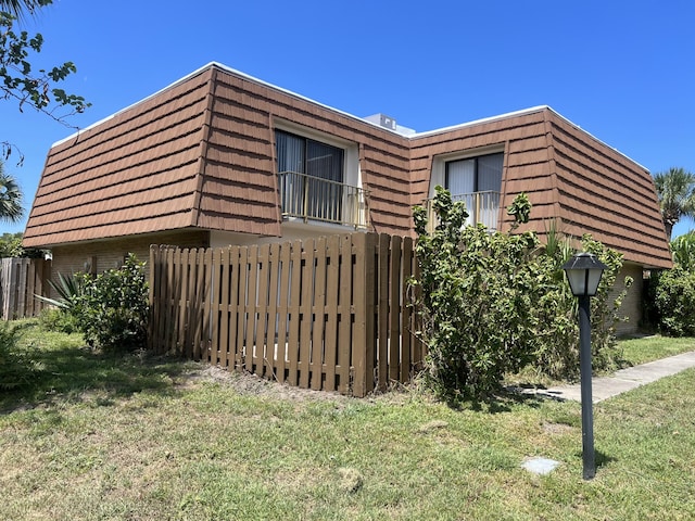 view of home's exterior featuring a lawn