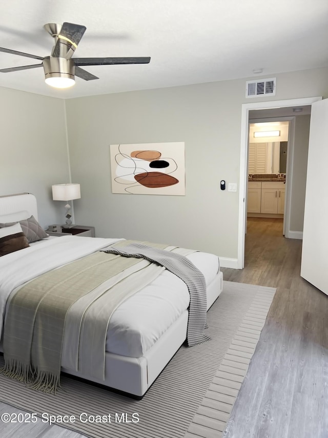 bedroom with ceiling fan and light hardwood / wood-style floors