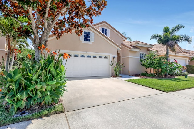 view of front facade featuring a front lawn and a garage