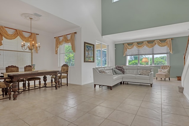 tiled living room featuring ornamental molding and a notable chandelier