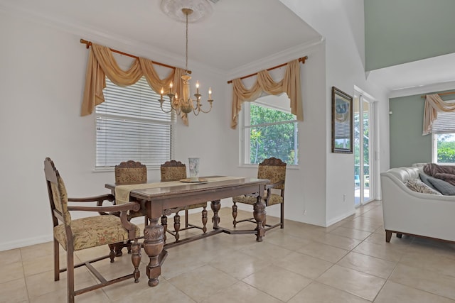 tiled dining room with a wealth of natural light, ornamental molding, and a notable chandelier