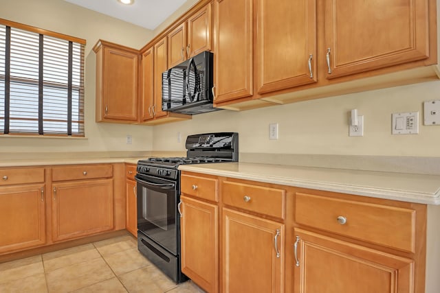 kitchen featuring black appliances and light tile patterned floors