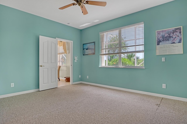 unfurnished room featuring carpet and ceiling fan