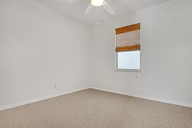 spare room featuring carpet and ceiling fan