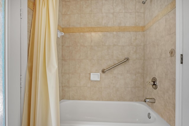 bathroom featuring shower / tub combo with curtain