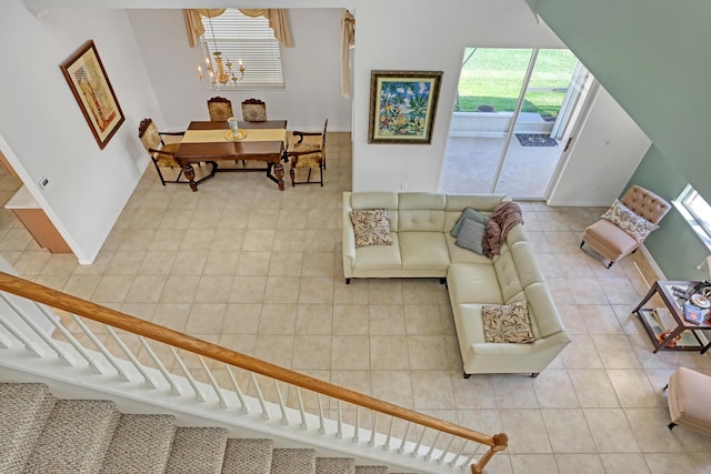 living room featuring tile patterned floors and a notable chandelier