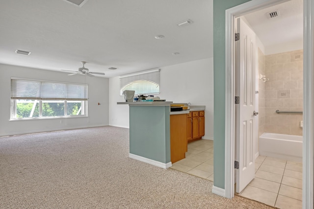 kitchen featuring ceiling fan and light tile patterned floors