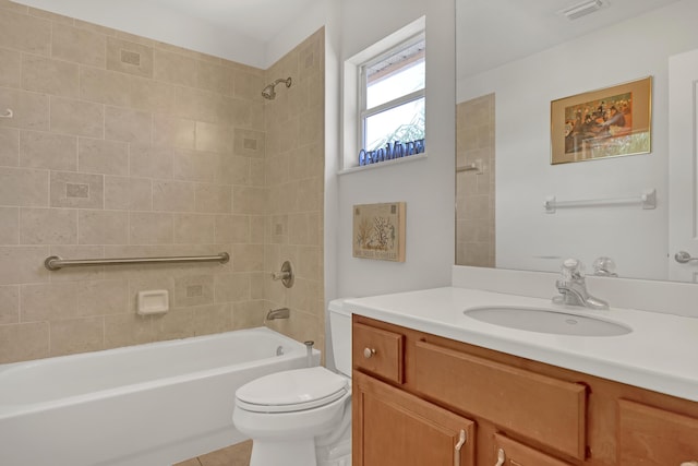 full bathroom with tile patterned flooring, vanity, toilet, and tiled shower / bath