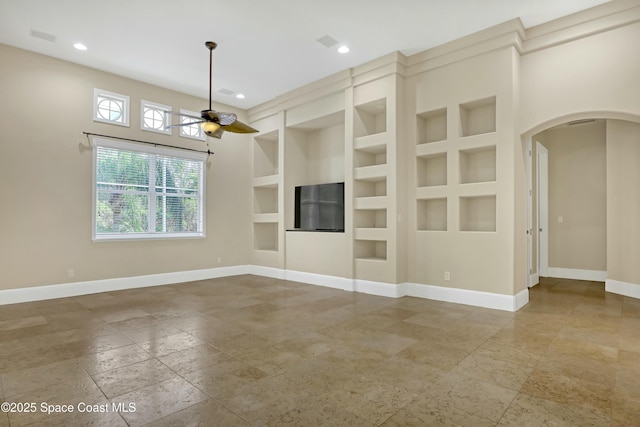 unfurnished living room featuring built in features and ceiling fan